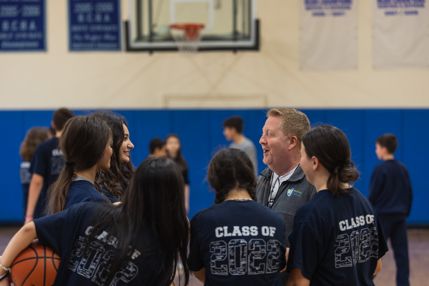 teacher and students in gym